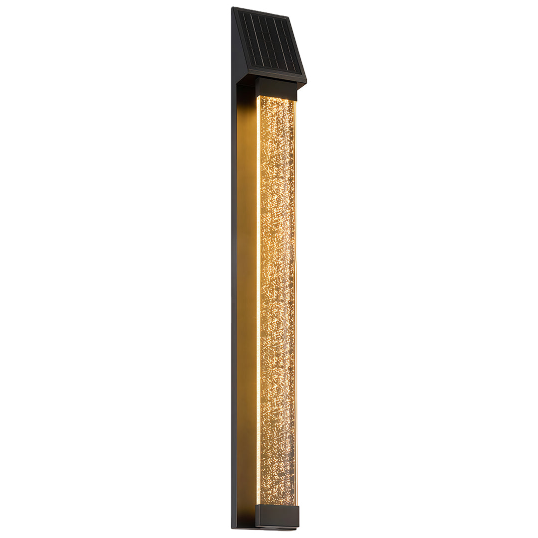 Black outdoor lighting sconce installed on a white exterior wall, enhancing the entrance with soft lighting.