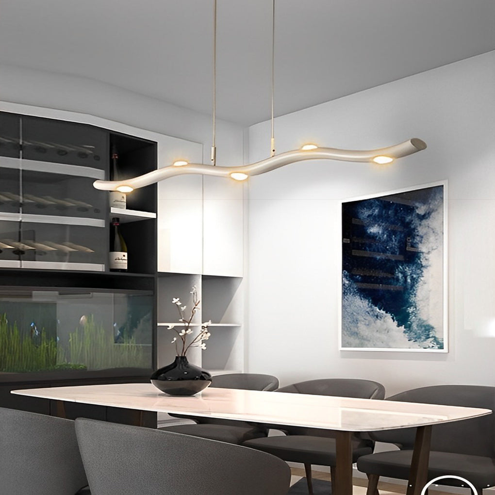 White wave pendant light with a minimalist design, enhancing a modern dining room.