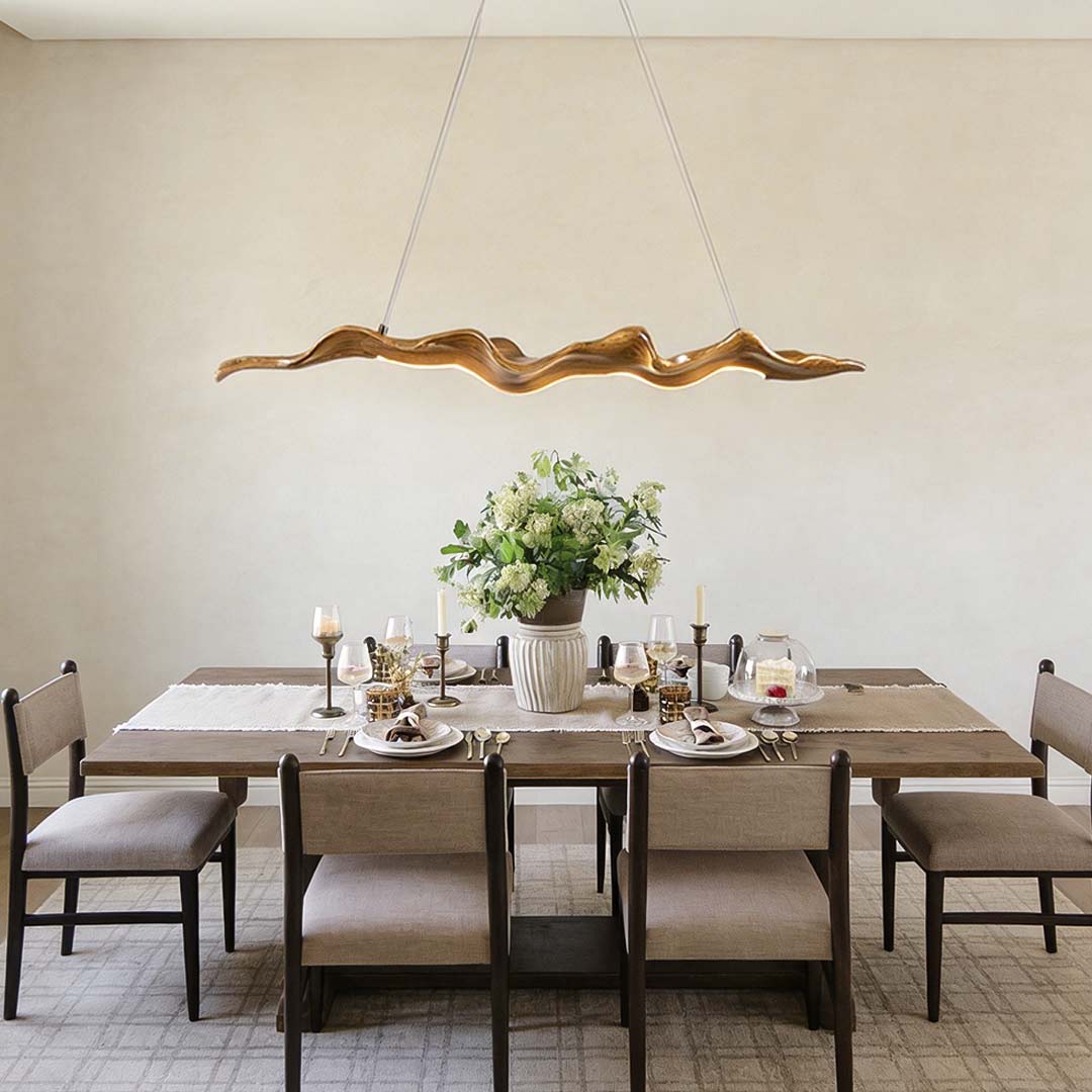 Wood pendant light chandelier wave design, illuminating a modern dining room with natural decor.