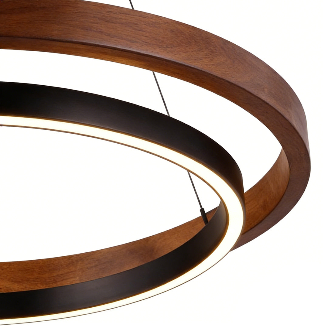 Wood ring pendant light with a modern design, hanging above a kitchen island.