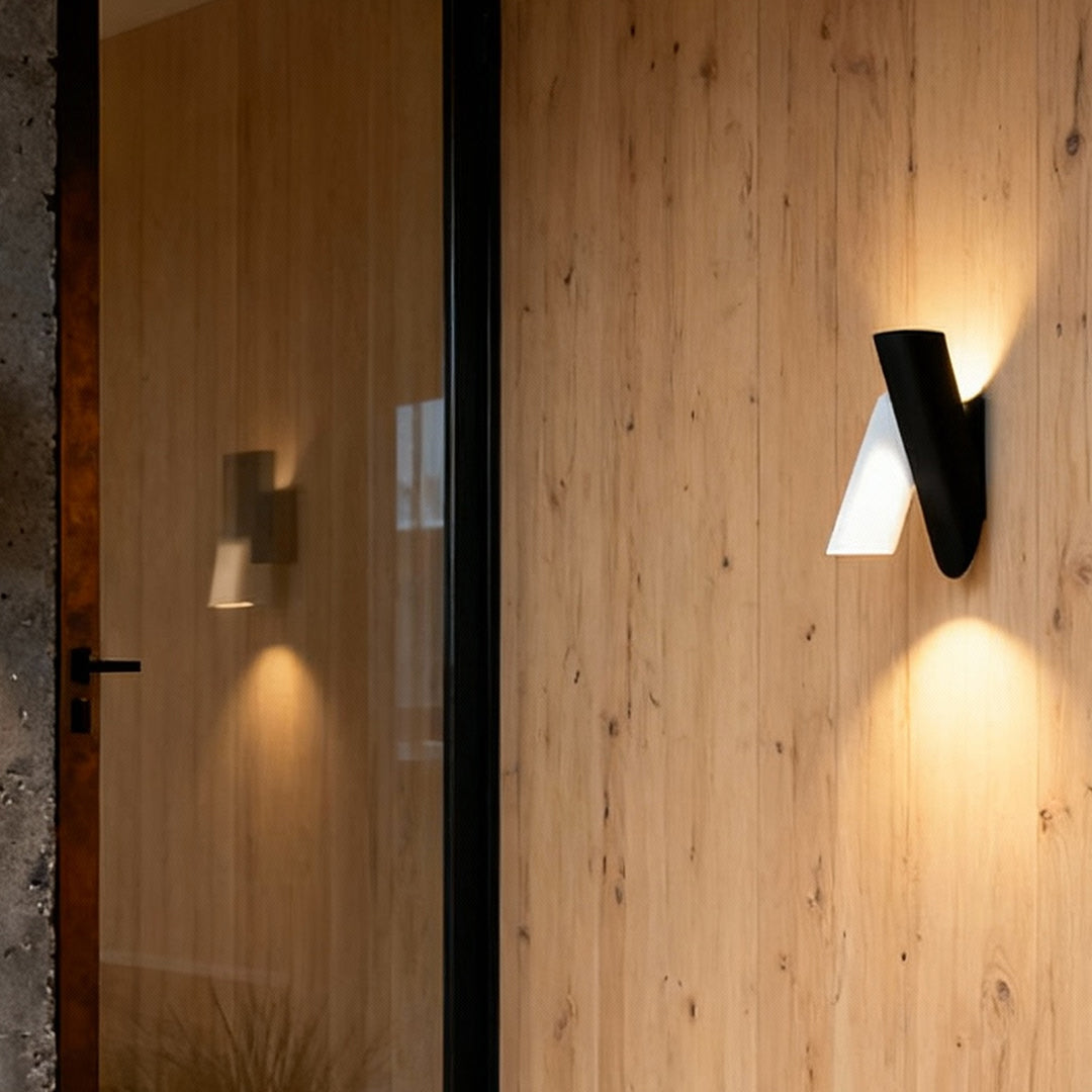 Up and down wall lights outdoor mounted on wooden exterior wall providing warm evening lighting.