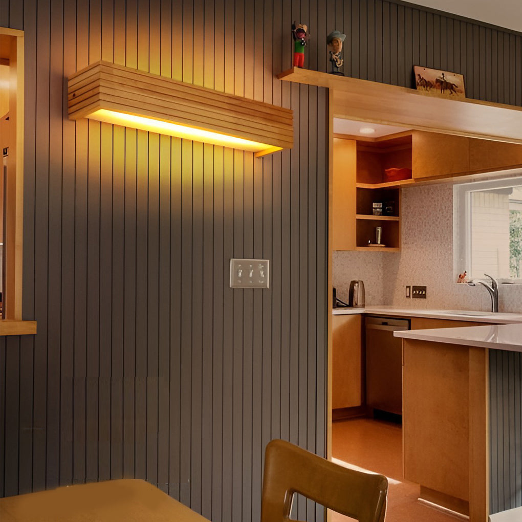 Wooden wall lamp used in a dining and kitchen area, adding natural texture and warm accent lighting.