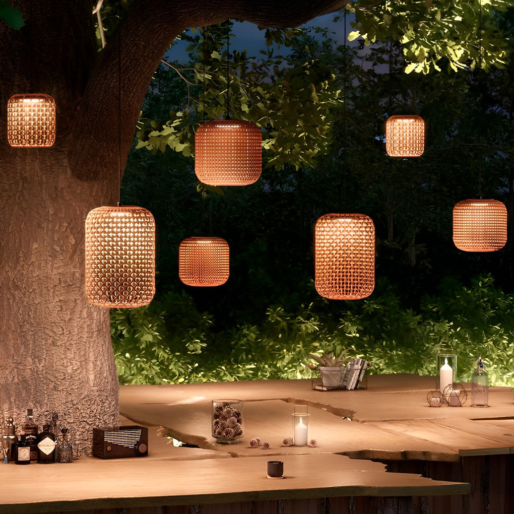 Woven hanging lantern with a rustic design, enhancing a cozy patio dining area.