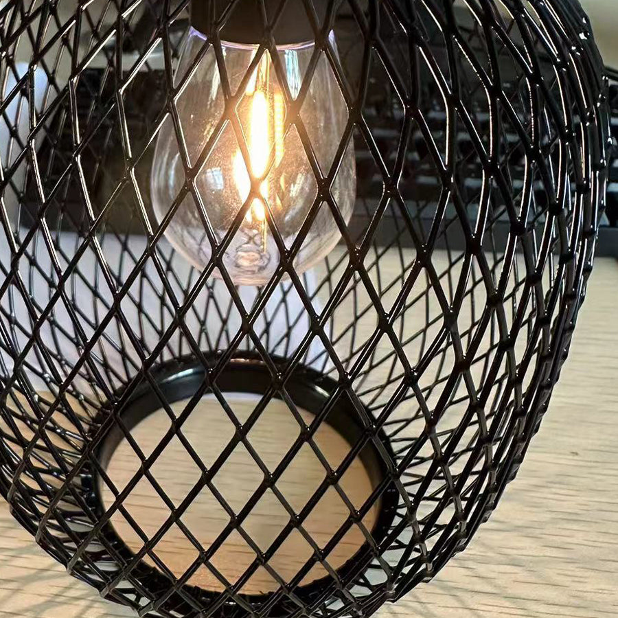 Close-up detail of woven rattan hanging lantern showing intricate basketweave pattern and texture