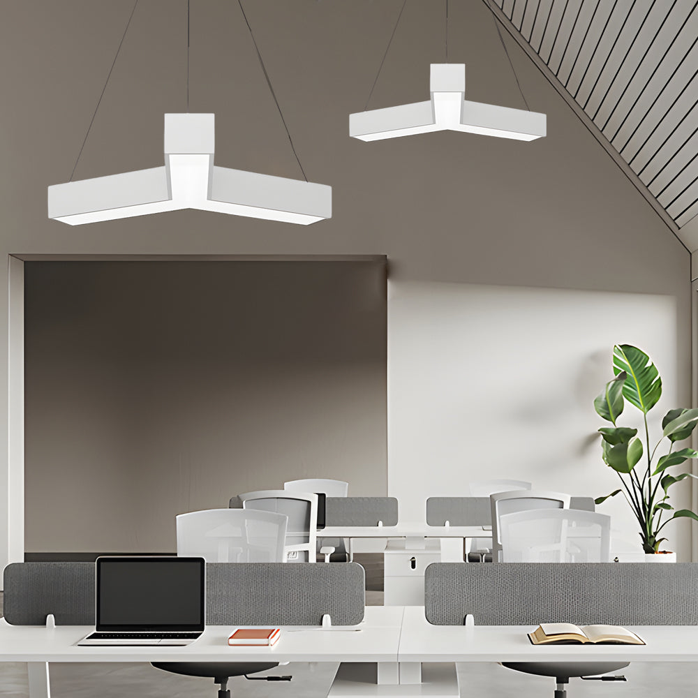 Y shaped linear pendant lights in a modern office space