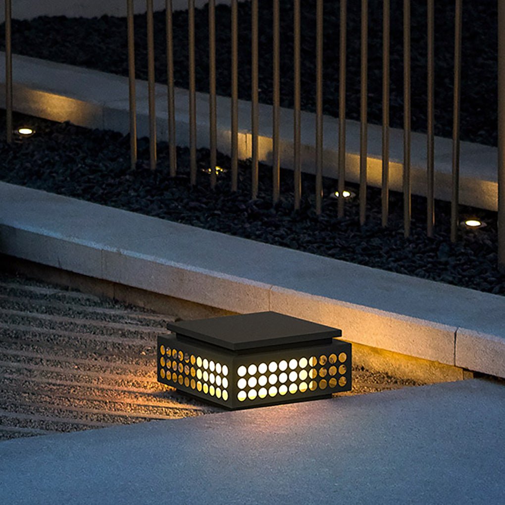 Zen garden light illuminating a garden fence with a minimalist and elegant design.